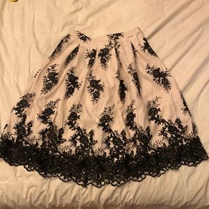nude and black lace floral knee length skirt, size medium